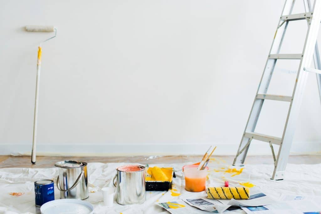 Expert Interior and Exterior Painting | King & Pierce Counties Buckets of paint on the floor