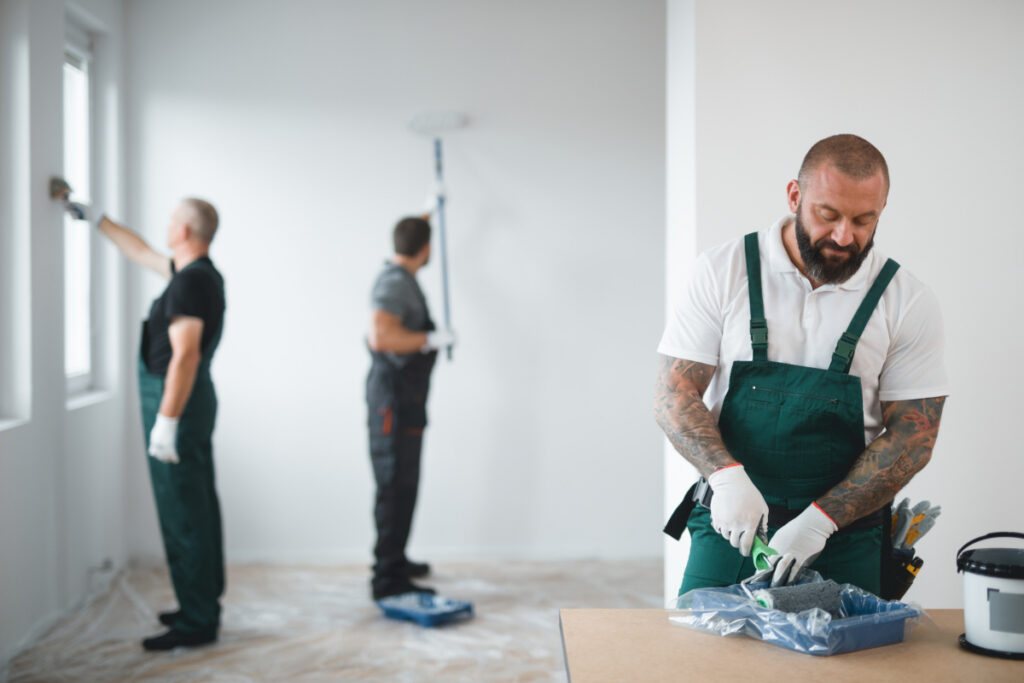 A painting crew working on the interior of their painting project for a house in Tacoma Washington