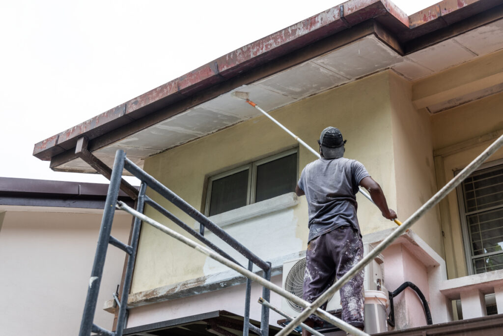 Employee working on a painting project for a Tacoma home owner.
